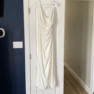 New, never worn wedding dress (I wore another one). White, size 14. Great dress!